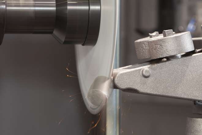 MEPSA robotic cell cutting excess material from a cast part